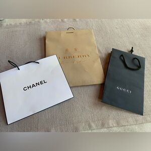 Lot of designer bags. Gucci, Burberry, Chanel